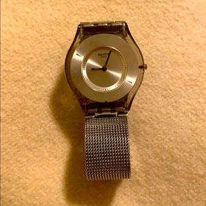 Silver flat Swatch watch
